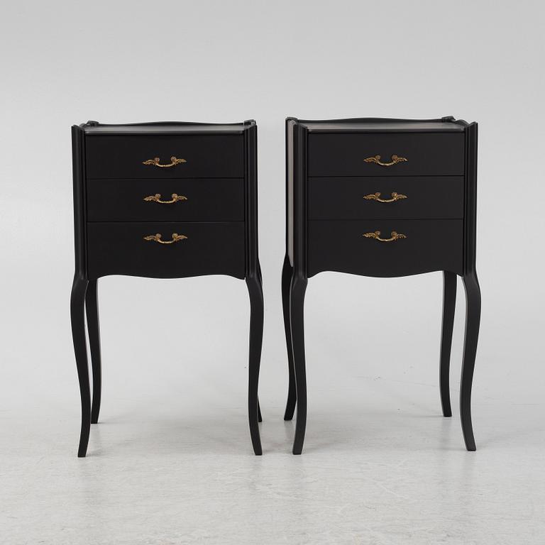 A painted pair of bedside tables.