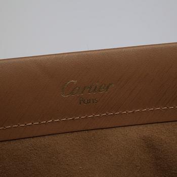 CARTIER, a beige leather handbag and wallet.