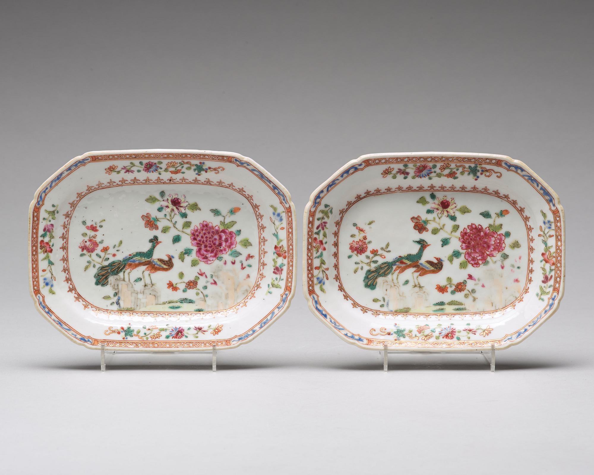 A pair of famille rose 'double peacock' butter tureens with covers and stands, Qing dynasty, Qianlong (1736-95).