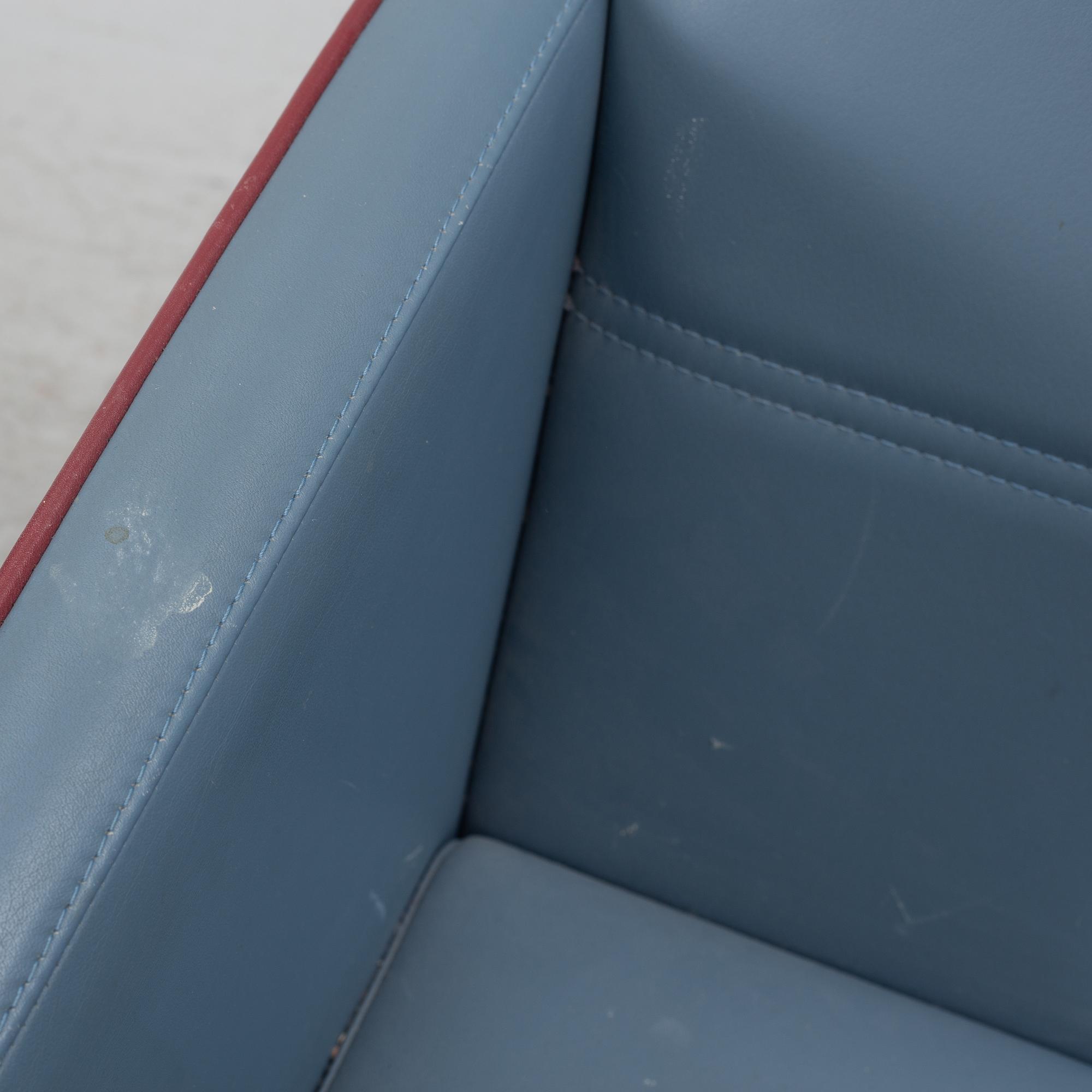 A pair of 1980s armchairs.