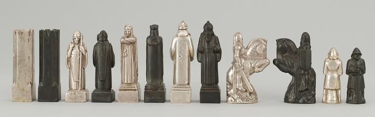 A Tore Strindberg (1882-1968) set of 32 pewter and metal chess pieces, Herman Bergman, Stockholm.