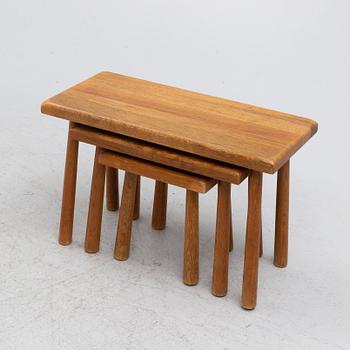 A set of three nesting oak tables or stools. second paert of the 20th century.