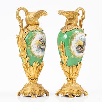 A pair of Louis XV-style gilt bronze and porcelain decorative ewers, France, later part 19th century.