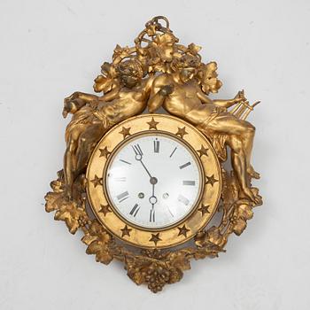 An Empire wall clock, 19th Century.