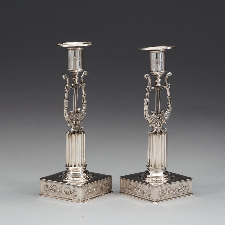 A pair of Swedish 19th century silver candlesticks, makers mark of Johan Petter Grönvall, Stockholm 1823.