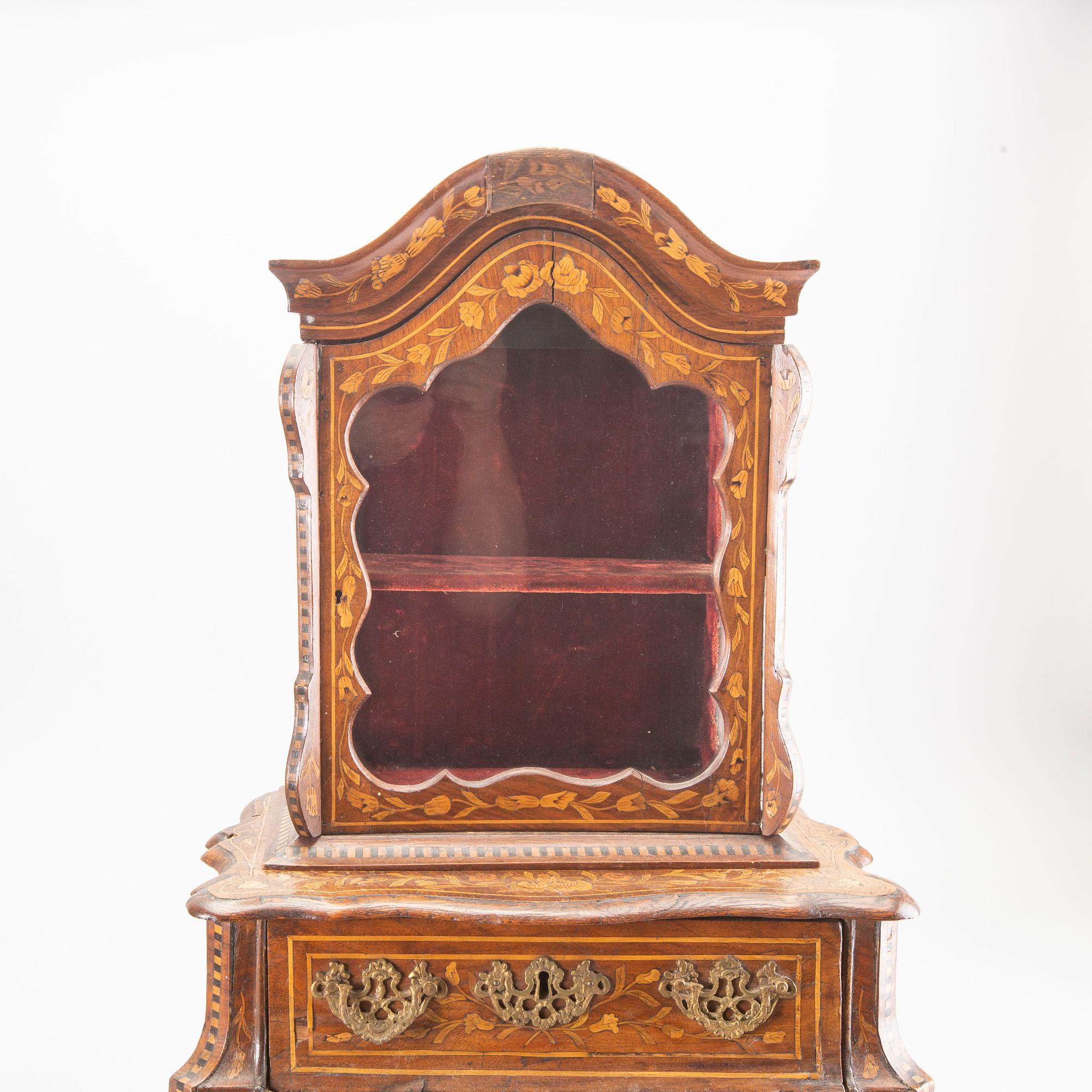 A Louis XV-style miniature cabinet around 1900.