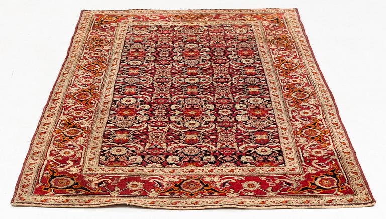 An antique Agra rug, ca 208 x 127 cm.