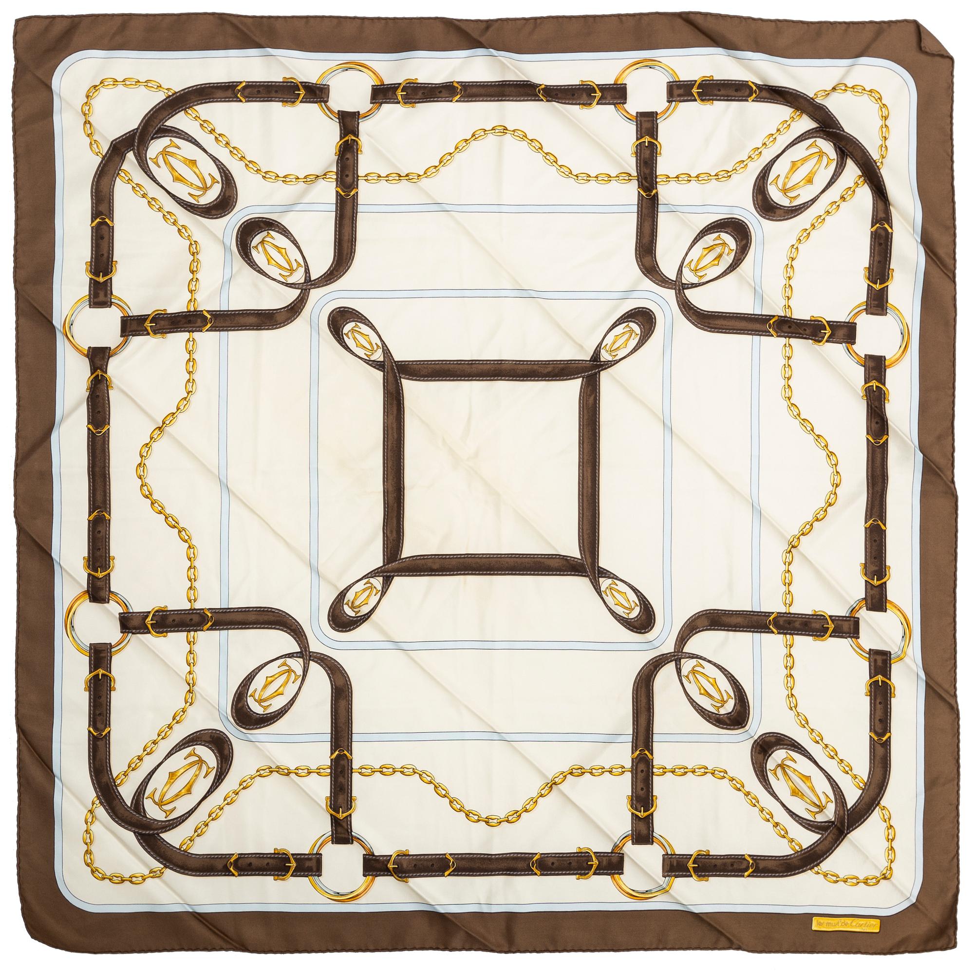 Three Cartier silk scarves.