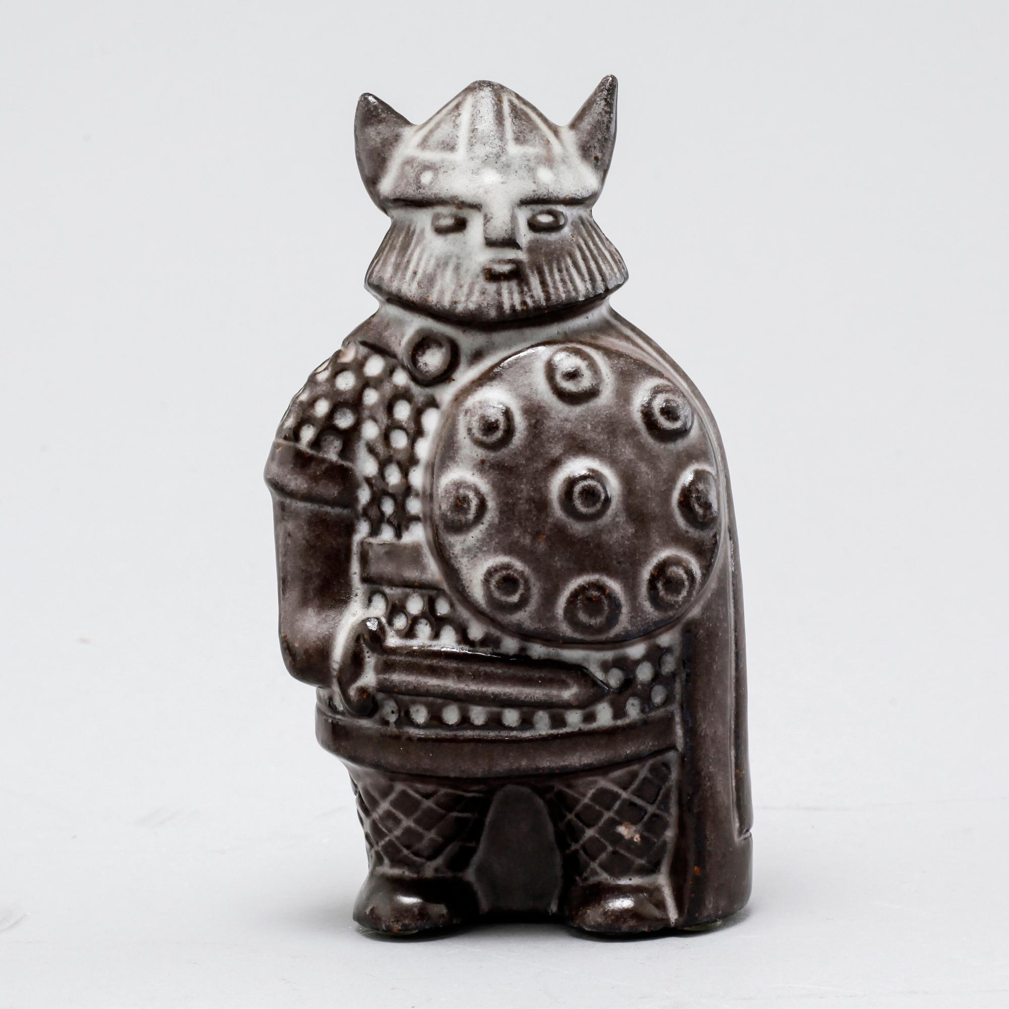 Eight stoneware figurines by Uppsala-Ekeby, from the latter half of the 20th century.