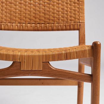 Hans J. Wegner, a set of 10 oak and rattan 'CH31' chairs, Carl Hansen & Son, Denmark 1950s.