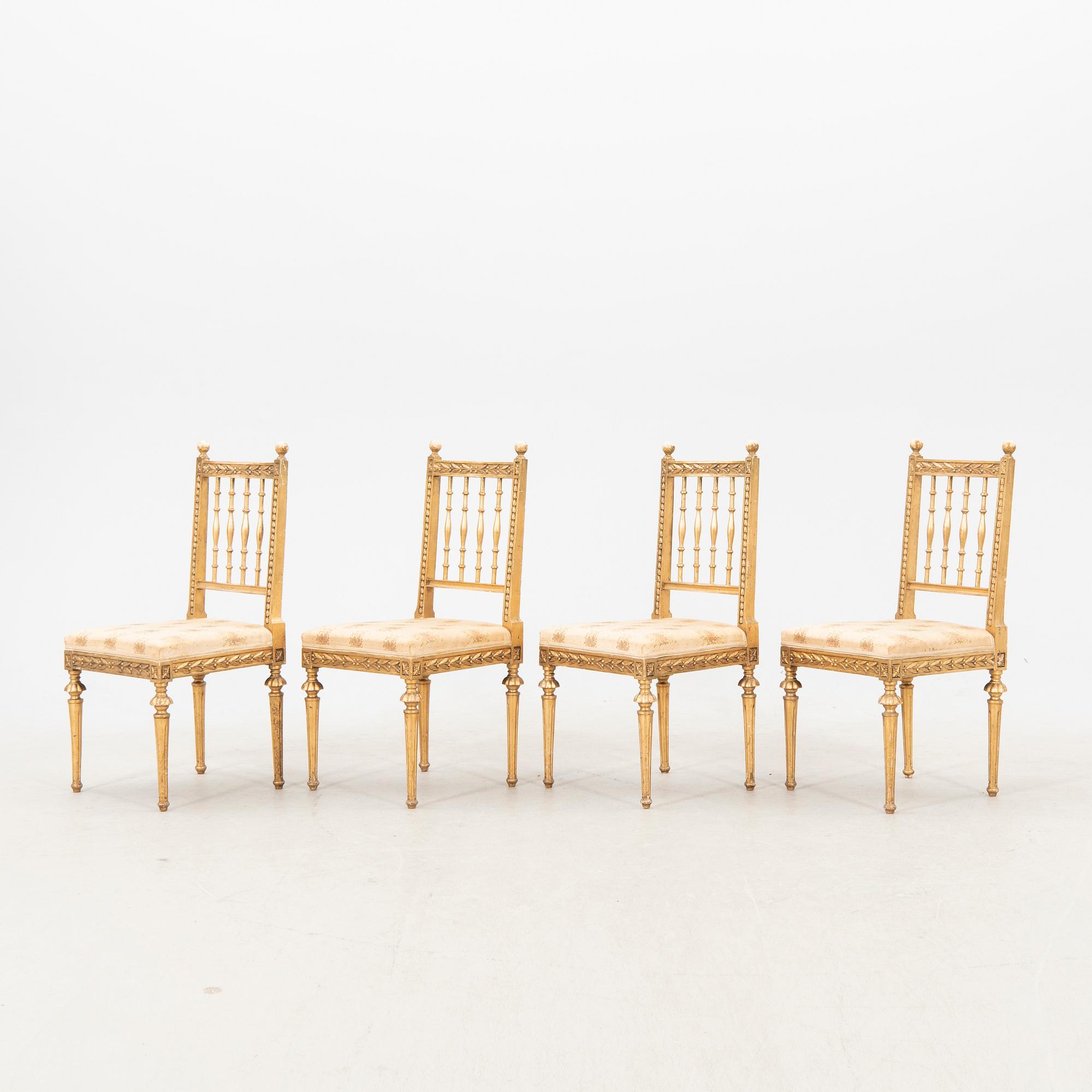 A set of four early 20th century Louis XVI-style chairs.