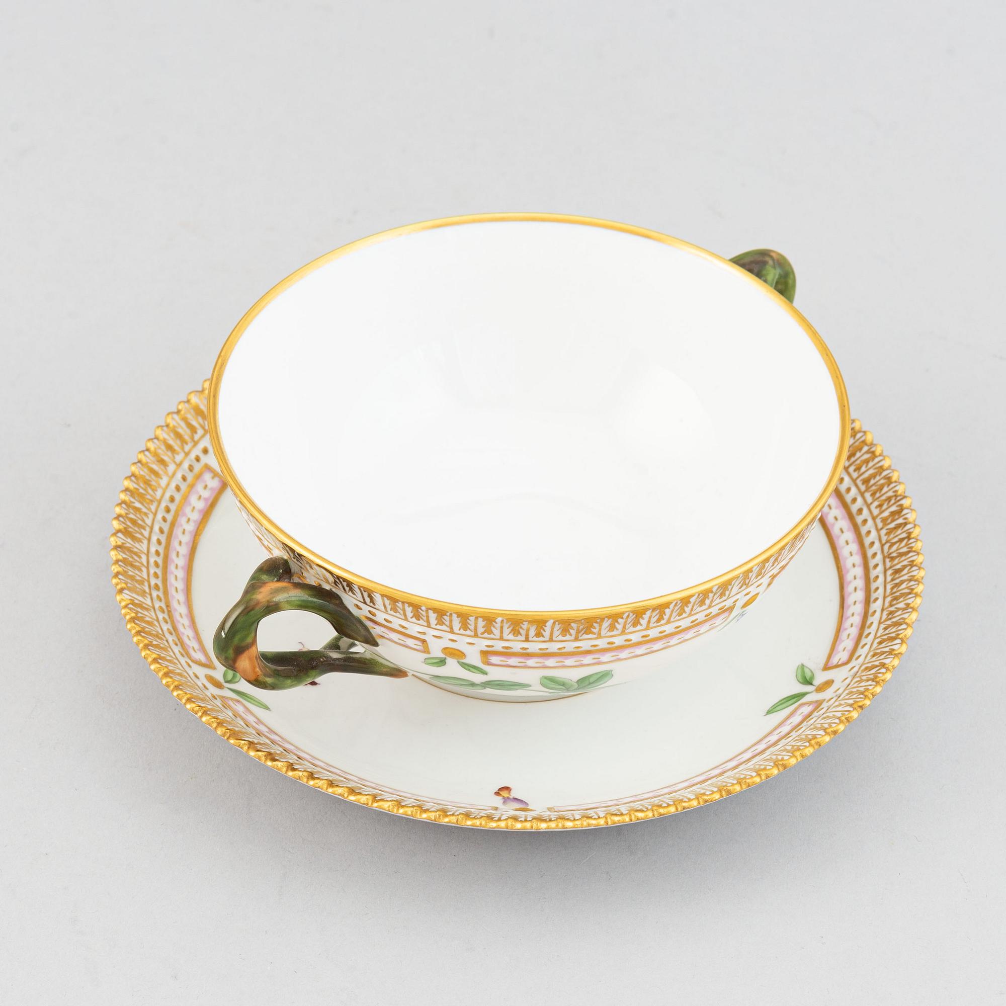 Royal Copenhagen, A 'Flora Danica' porcelain soup cup with saucer.