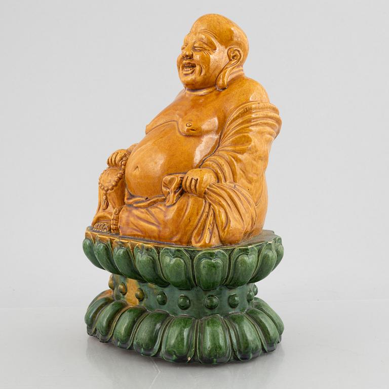 A ceramic Budai, China, 20th century.