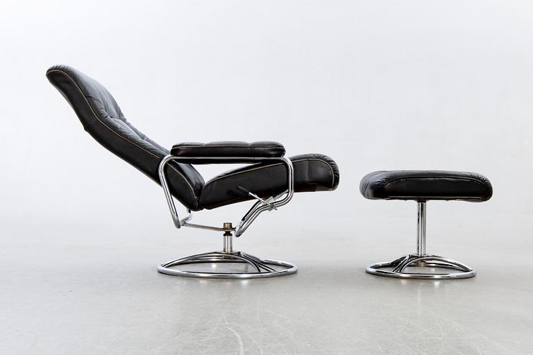 A leather swivel armchair and stool, Söderbergs  1980s.