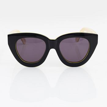 Karen Walker, a pair of "Anytime" sunglasses.