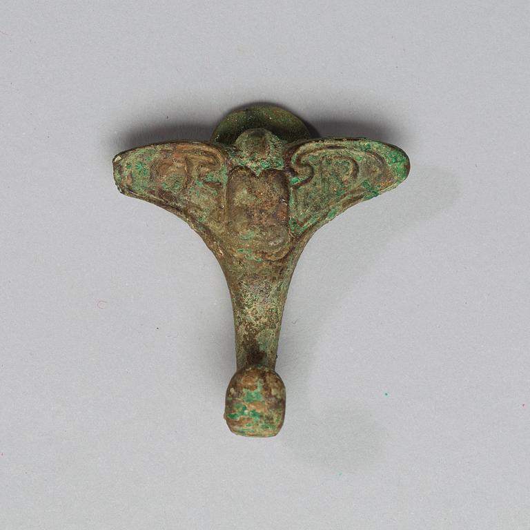 A bronze belt-hook, Zhou Dynasty (c. 1050-221 BC).