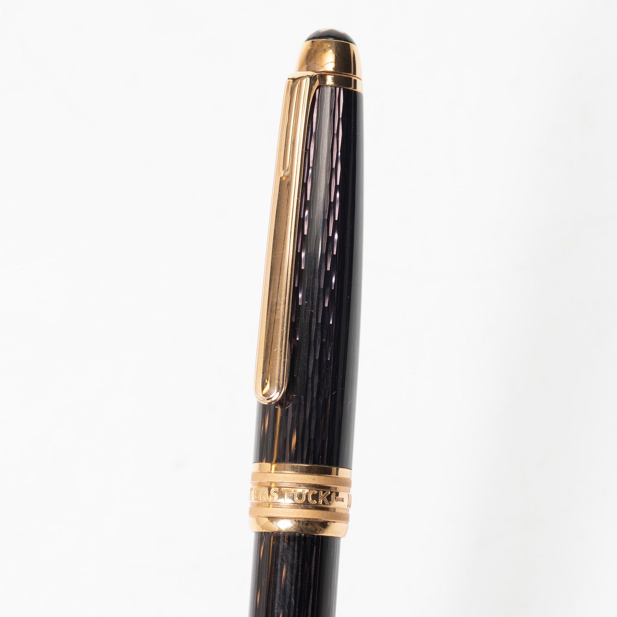 A Mont Blanc Meisterstück 90th Anniversary ed.  ballpoint pen with a case.