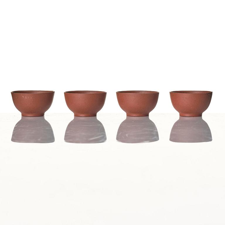 A miniature tea pot with cover, four cups and a dish, China, 20th century.