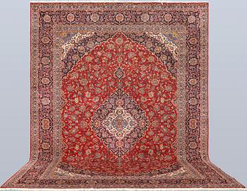 A signed Keshan carpet, approx. 470 x 355 cm.