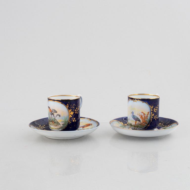 A set of nine porcelain coffee cups with saucers, Kuznetsov, Russia (1891-1917).