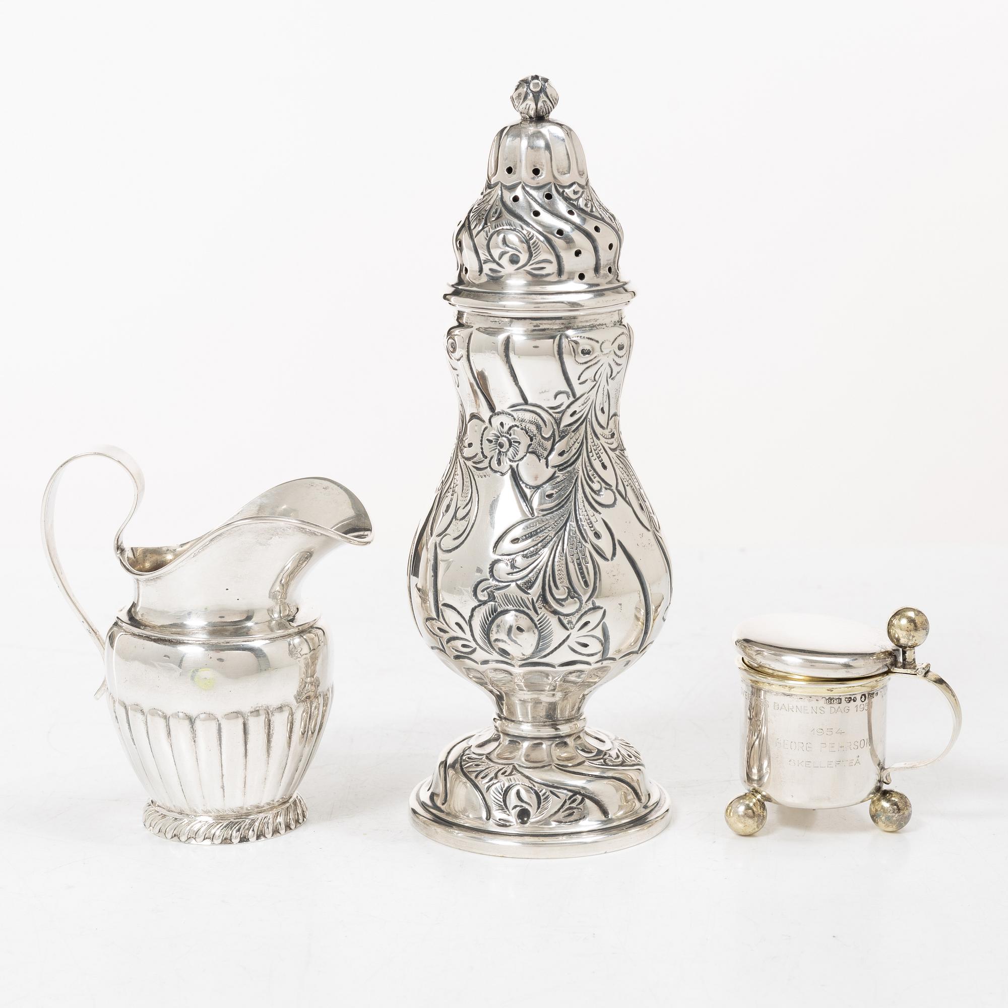 Sugar tongs, cream jug and miniature decanter, silver, including CG Hallberg, Stockholm 1955.