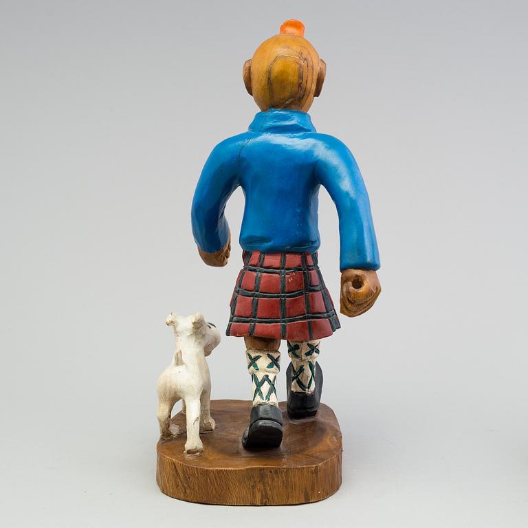 a Tintin and snowy wood scuplture from the second half of the 20th century.