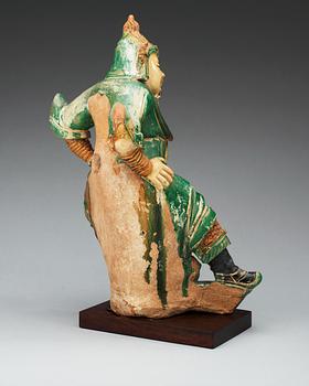 A gren and yellow glazed roof tile figure, Ming dynasty.