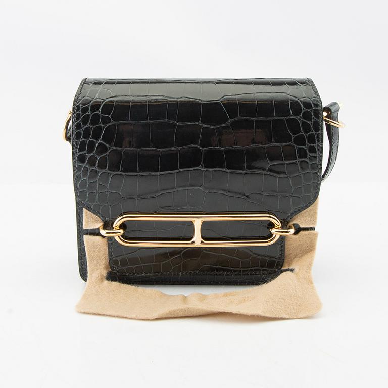 Hermès, bag "Green Shiny Alligator Mini Roulis 18 Permabrass Hardware" 2021.