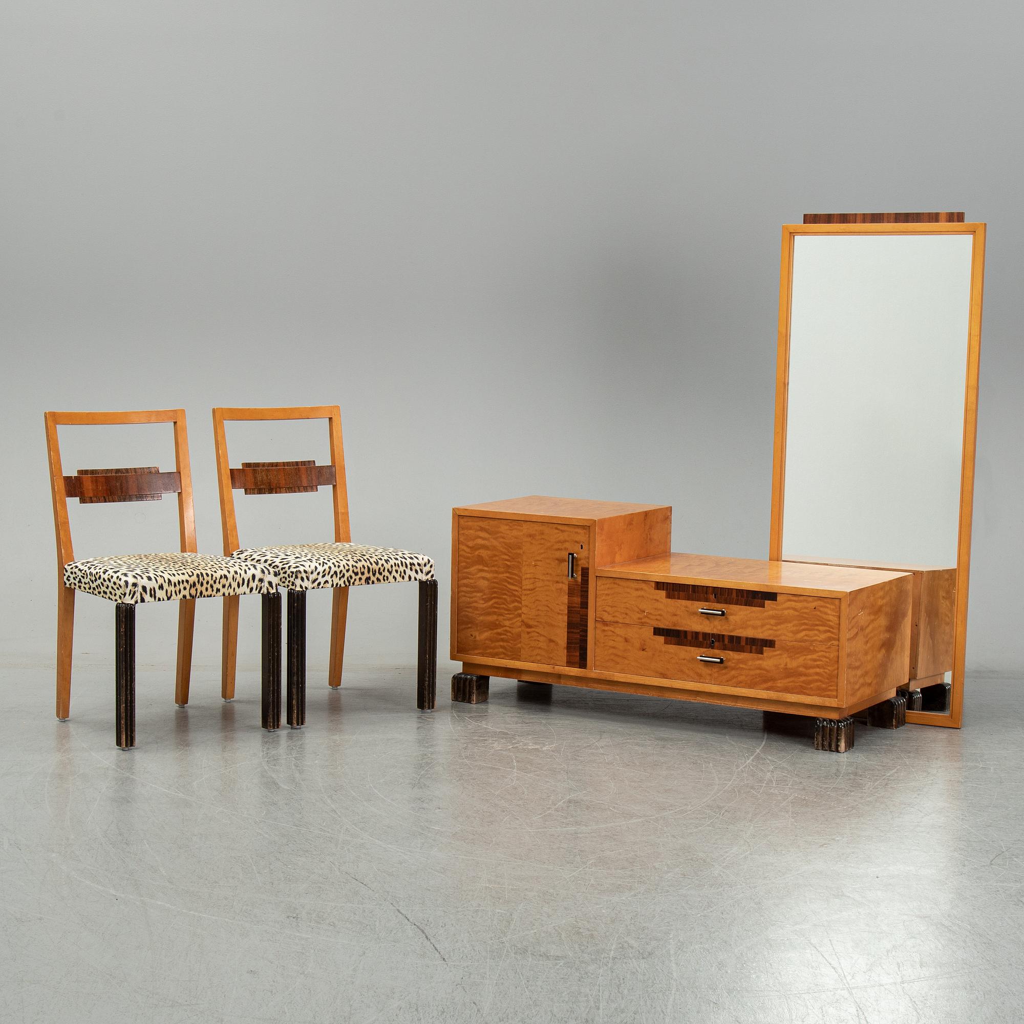 A dressing table with mirror and two chairs, 1930's.
