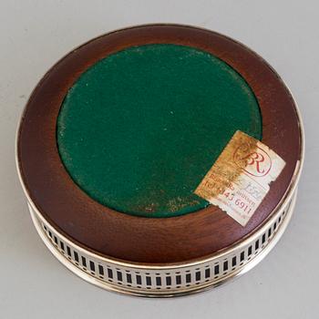 Six mahogany and sterling silver coasters, Carrs of Sheffield, Shefield, England 2003.