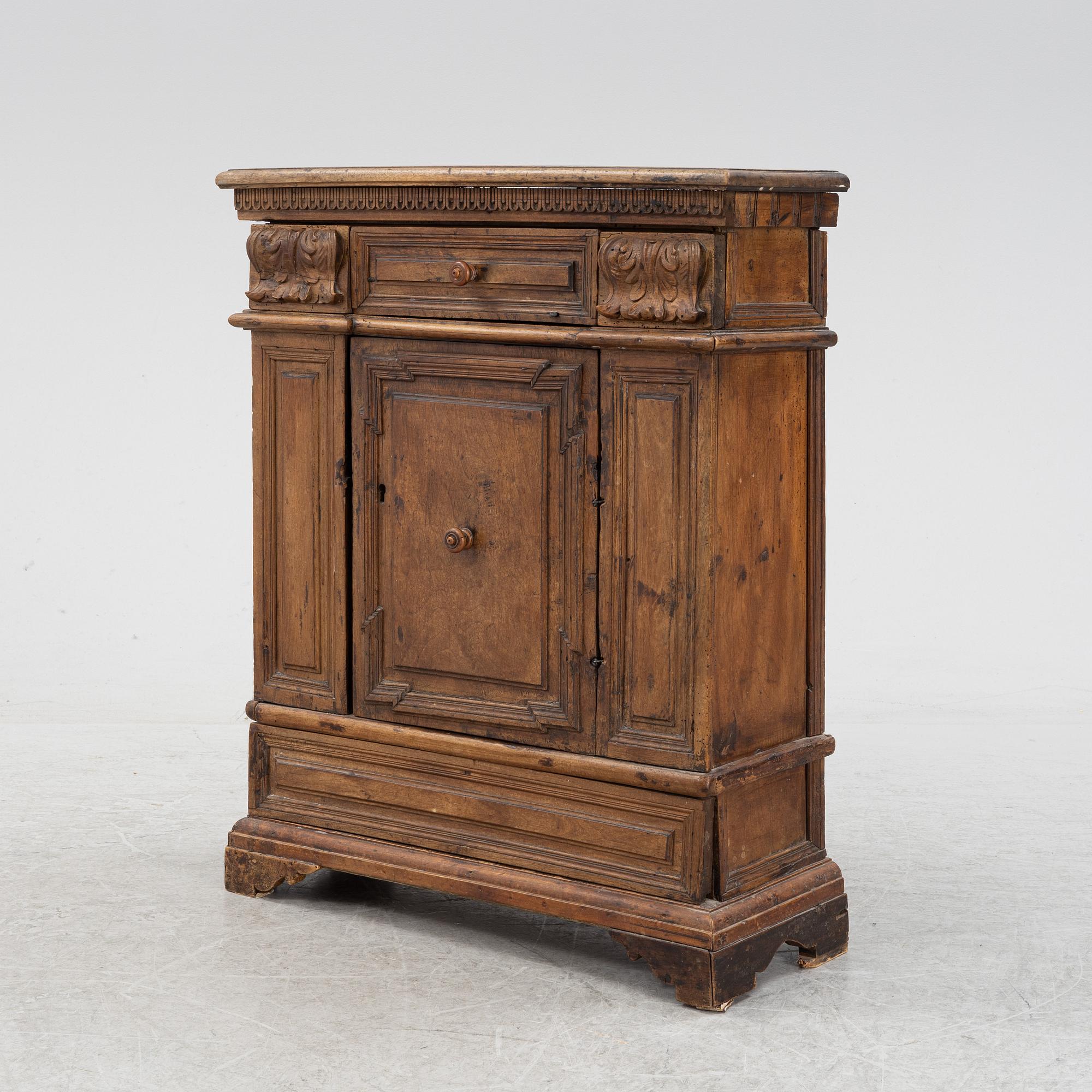 A Baroque style cabinet, circa 1900 with older parts.