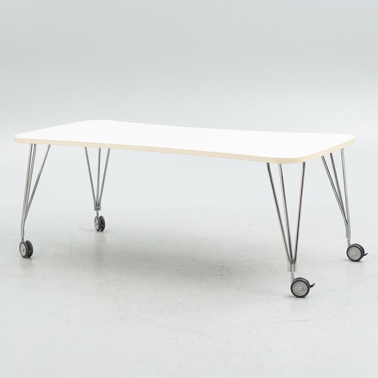 A contemporary table on wheels.