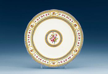 1250. A Sèvres lobed plate, 18th century, with painter´s mark Madame Taillandier. Gilders mark for E-G Girard.