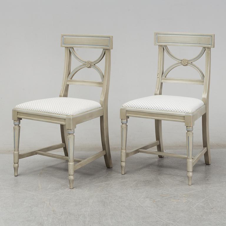 A dining table and six chairs, Gustavian style, second half of the 20th century. One leaf included.