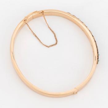 ARMRING med cabochonslipade turkoser.