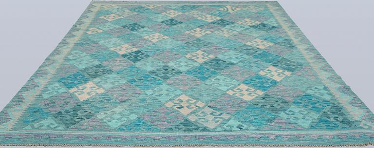 A Kelim carpet, c. 291 x 248 cm.