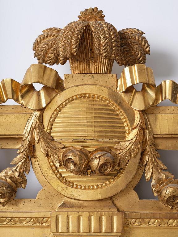 A Gustavian giltwood mirror by C. G. Fyrwald (master in Stockholm 1776-1825).