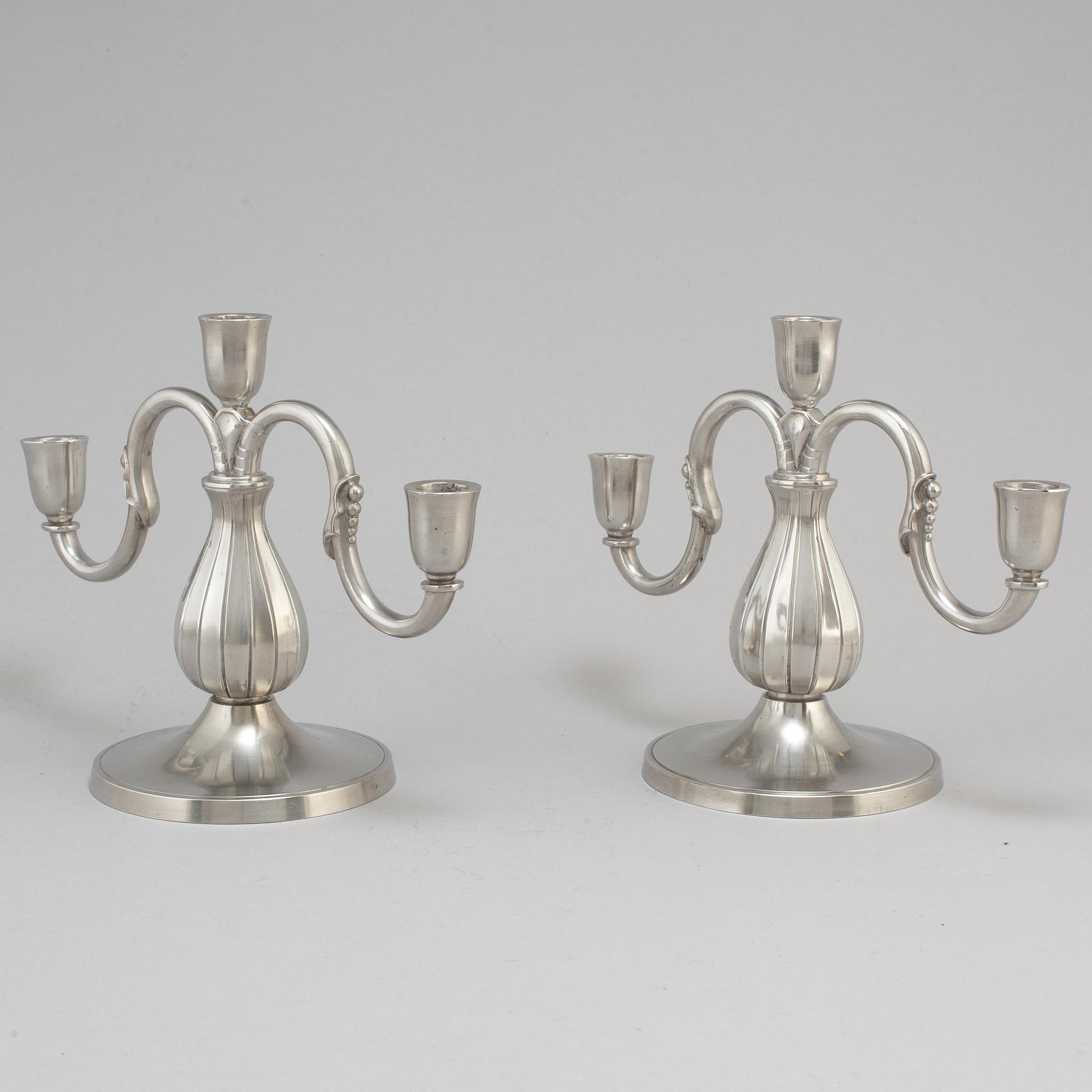 A pair of pewter candelabra from GAB Tenn, Stockholm, 1935.