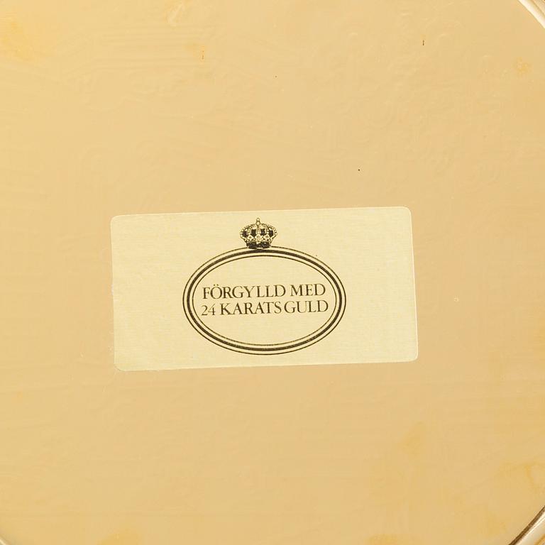 12 brass plates by Skultuna.