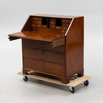 A mahogany veneered secretaire, early 19th Century.