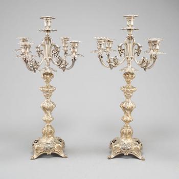 A pair of silver plate candelabra, 20th century.