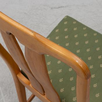 Carl Malmsten, a model "Ambassadör" dining table with ten chairs, Sweden, second half of the 20th century.