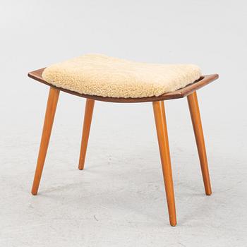 A teak stool with new sheepskin upholstery, 1960s.