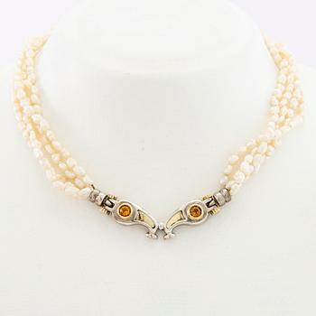Tonino Lamborghini, Necklace of cultured pearls with a pendant of 18K gold, silver, and faceted citrines.