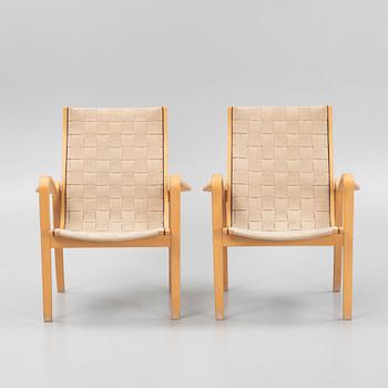 A pair of lounge chairs from Källemo.