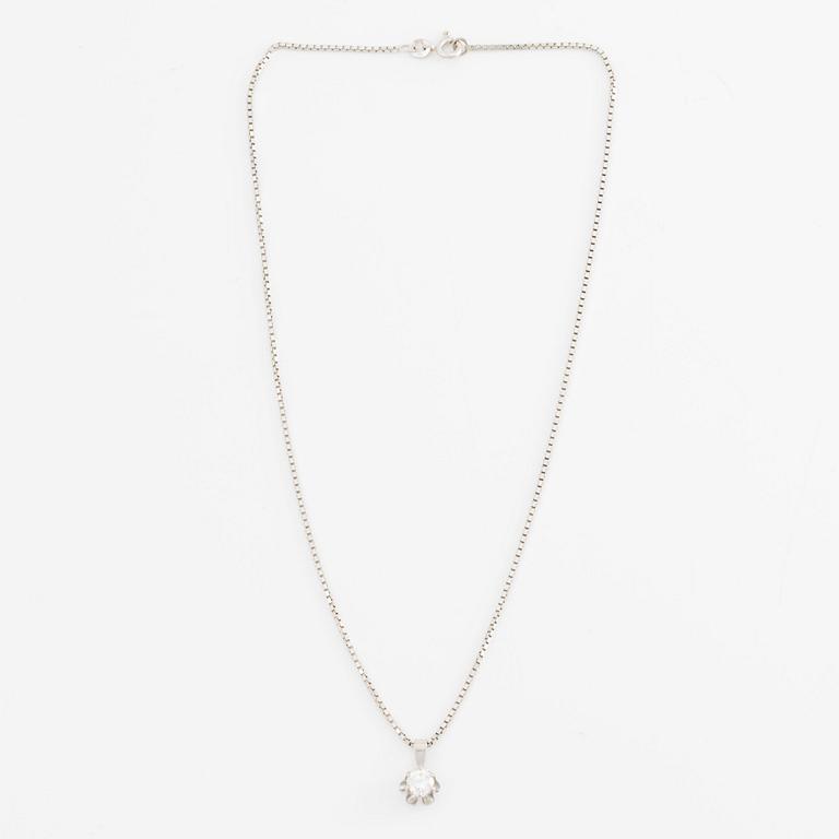 Pendant with chain in 18K gold and a round brilliant-cut diamond.