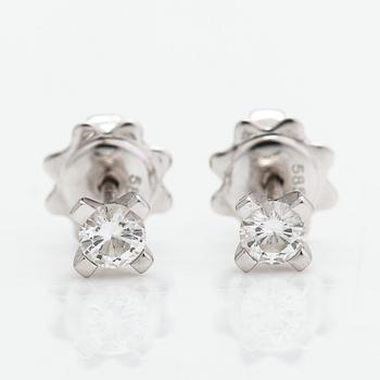 A pair of 14K whitegold earrings with brilliant cut diamonds ca 0.30 ct in total. With certificate.