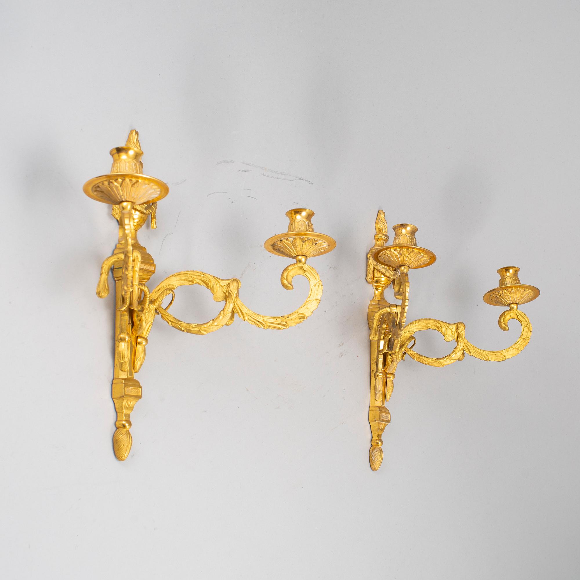 A 20th Century pair of Louis XVI style wall sconces.