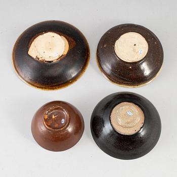 A group of four Southeast asian ceramic bowls and deep dishes, presumably 16/17th century.