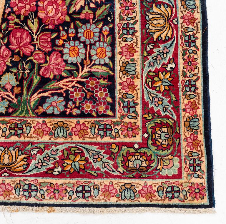 An antique Kerman, so called 'Millefleurs tree-of-life' rug, southeast Persia, c. 211 x 138 cm.